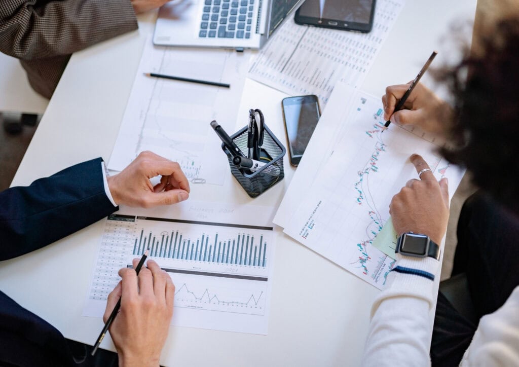 Financial planning documents and charts on a desk