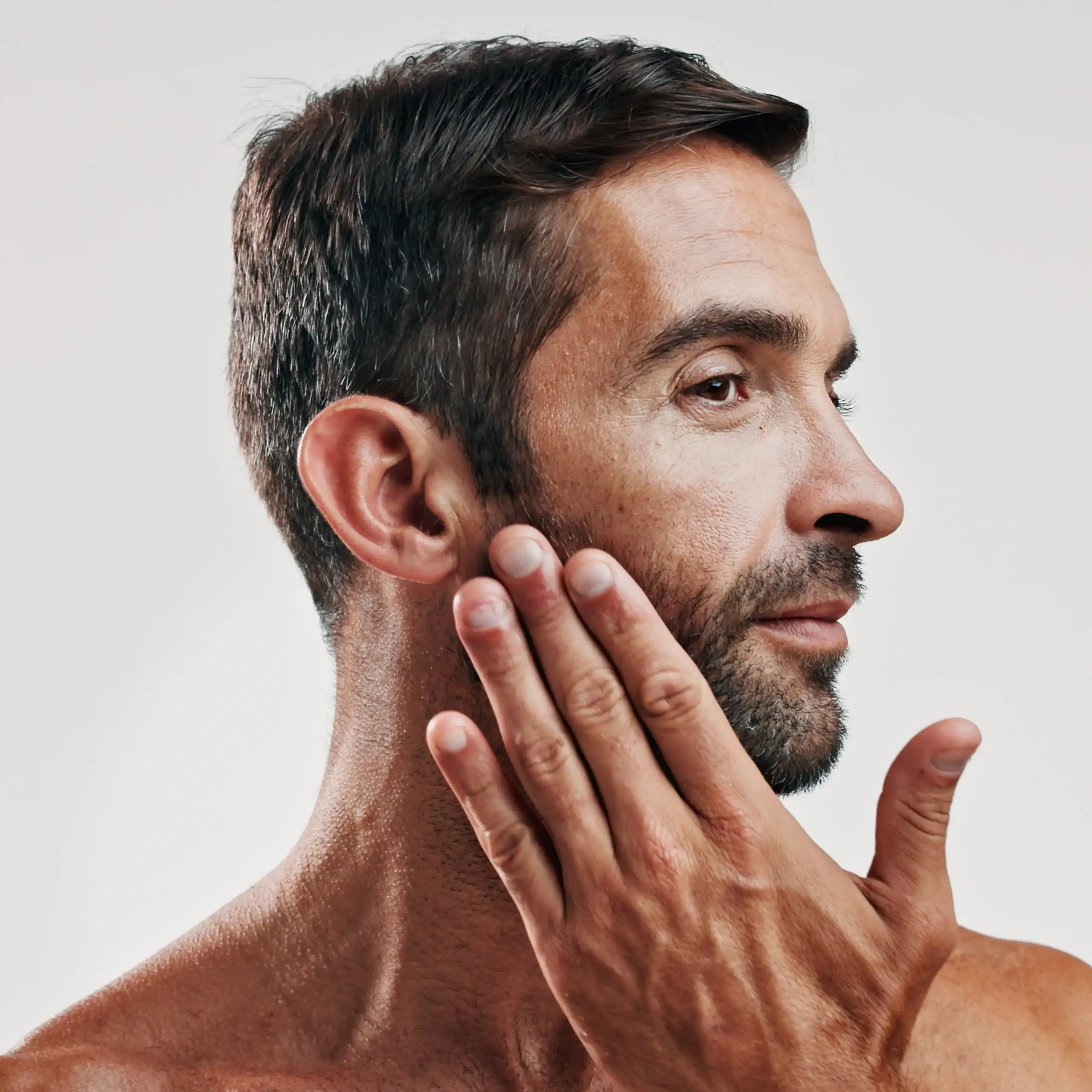 Middle aged man with nice skin and a beard