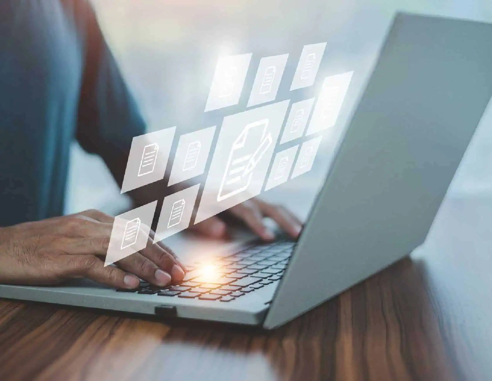 Digital file management and cloud storage concepts, with a person using a laptop to organise files and data.