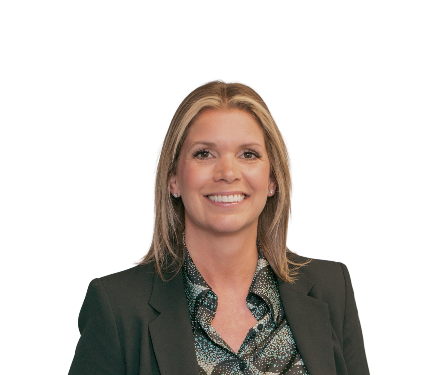 A professional woman with blonde hair, wearing a dark blazer and patterned blouse, smiling confidently in a corporate setting.