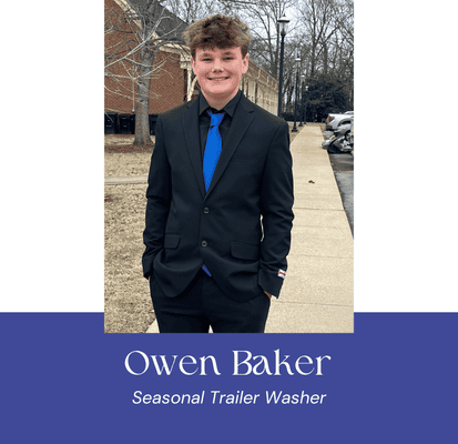 Young man in formal suit outdoors, smiling, for VannGo Site Services.