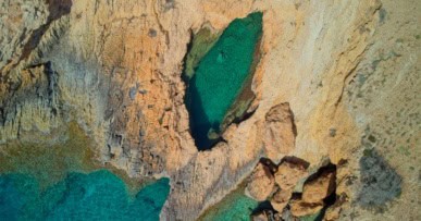Drone shot of Devils Eye Sea Cave on Koufonisia