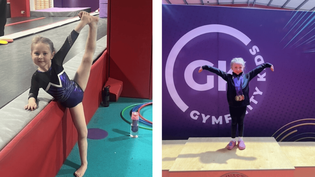 Flexible girl gymnast doing a split on the gymnasium floor, indoor gymnastics training, young female gymnast demonstrating skills.