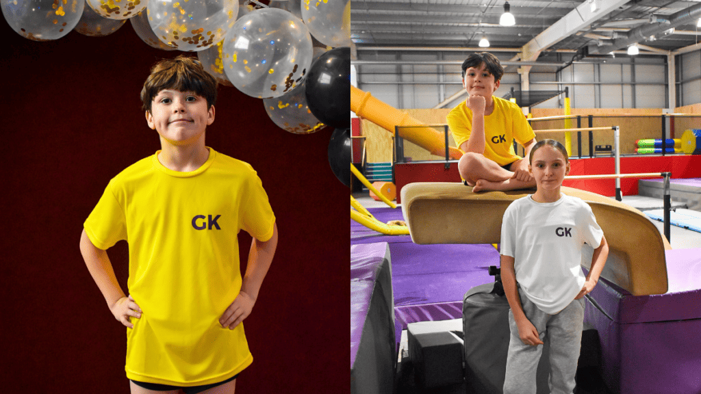 Boy in yellow GK t-shirt standing with balloons at an indoor celebration.