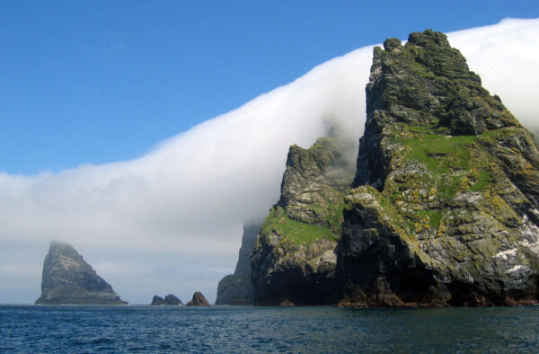 Scenic Hebridean cliffs and sea stacks reflecting the rugged beauty of the Outer Hebrides coastal landscape.