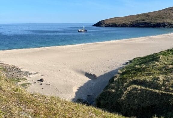 Mingulay with the Hjalmar Bjorge in the background