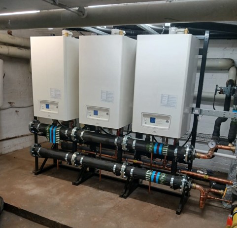 Modern boiler system installed by Halesowen Gas Services in a basement.