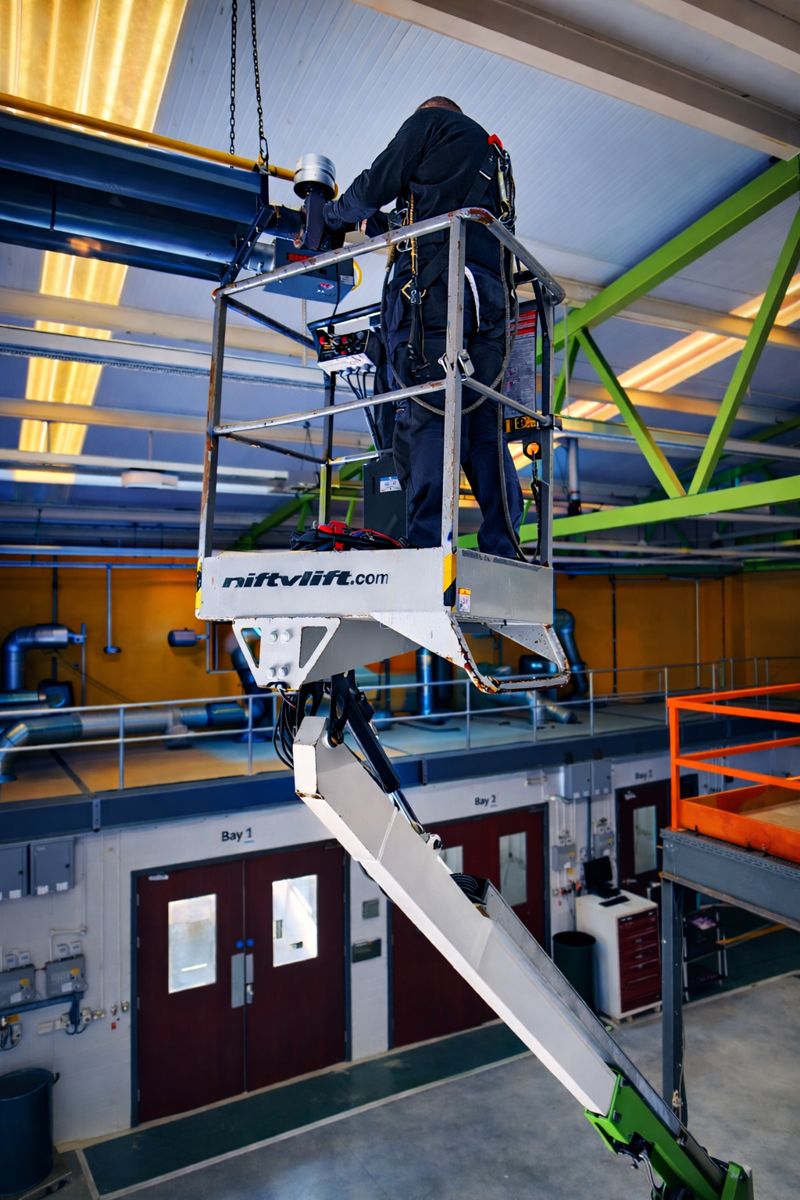 HVAC technician working on industrial heating system at Halesowen.