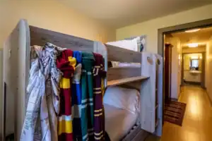 Bunk beds with colourful scarves in Highland Club Scotland accommodation.