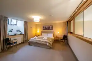Spacious Highland Club bedroom with modern decor and natural light.