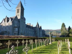 Historic castle at Highland Club Scotland with scenic surroundings.