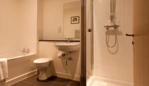 Bathroom with shower and toilet at Highland Club Scotland.