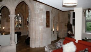 Interior of Highland Club with historic stone arches and elegant furnishings in Scotland.