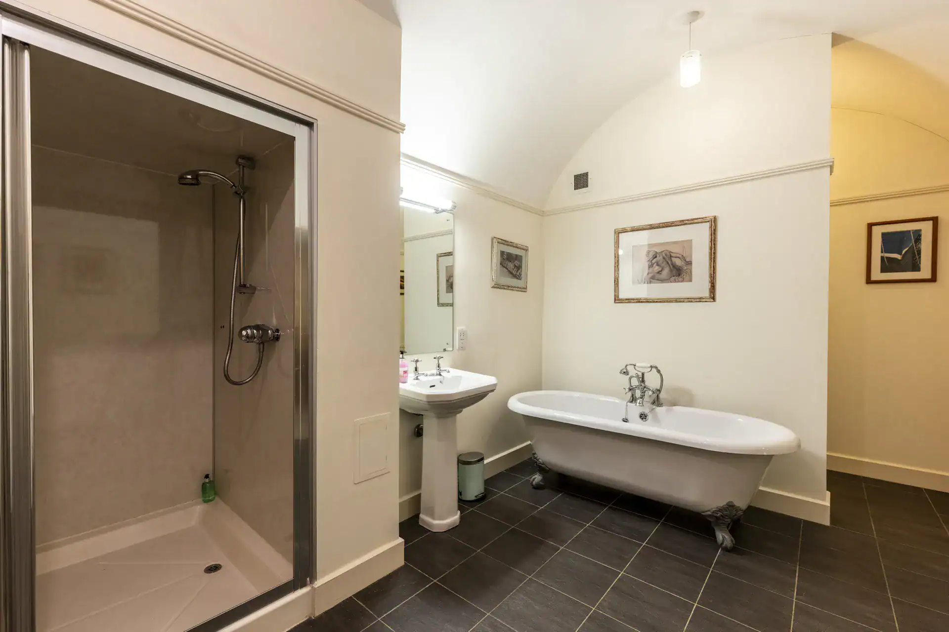 Bathroom with clawfoot tub, shower, and classic decor at Highland Club Scotland.