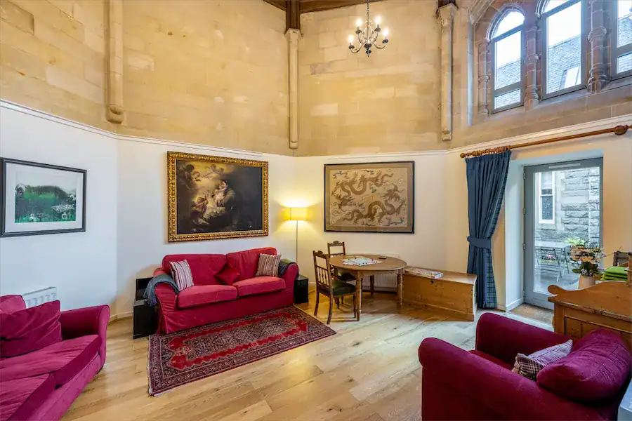Historic Highland Club lounge with vintage furniture and artwork.