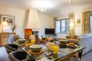 Bright Highland Club apartment with comfortable living and dining space.