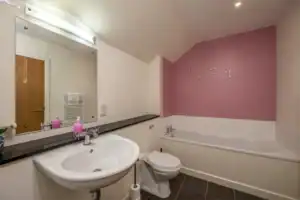 Bathroom with bathtub and sink at Highland Club development, Scotland.