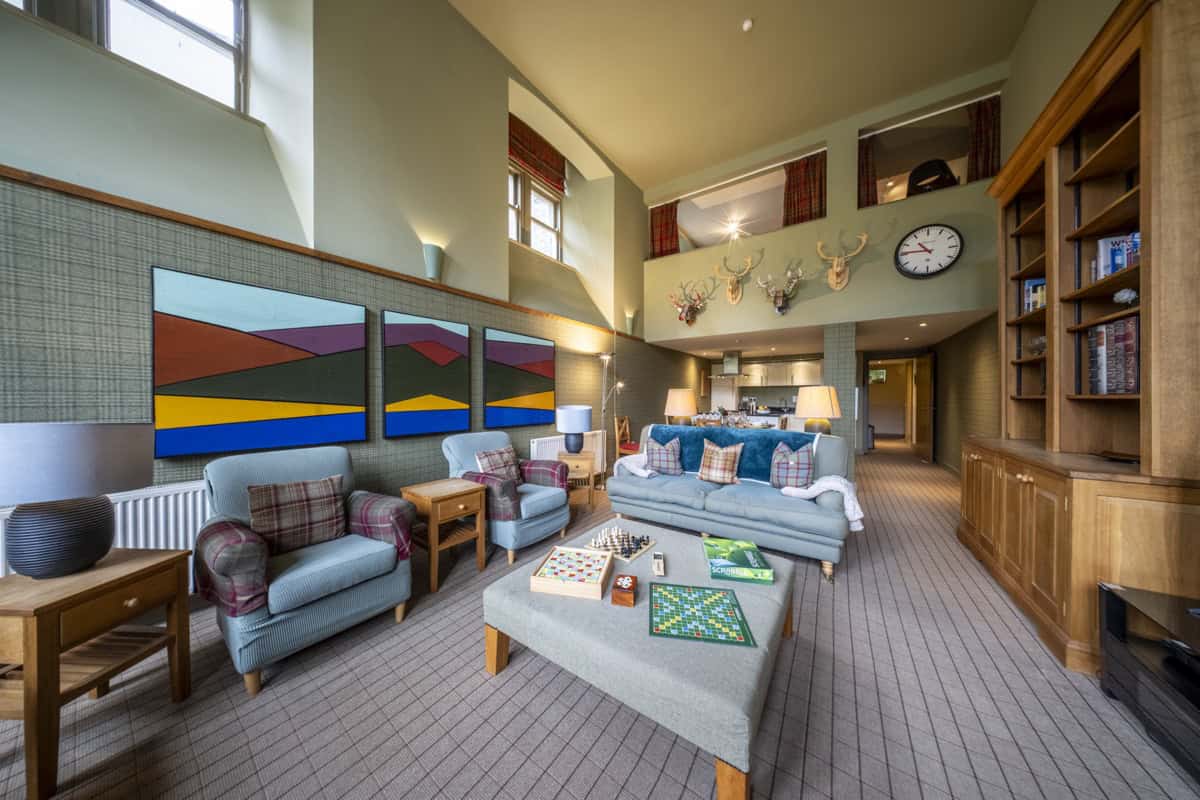 Luxury Highland Club lounge with modern decor and natural light.