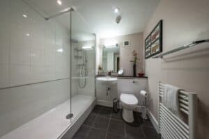 Highland Club Scotland bathroom with walk-in shower and contemporary fixtures.