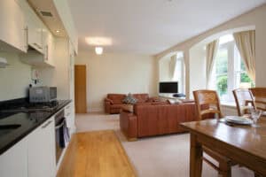 Spacious Highland Club Scotland apartment with open-plan living and dining area.