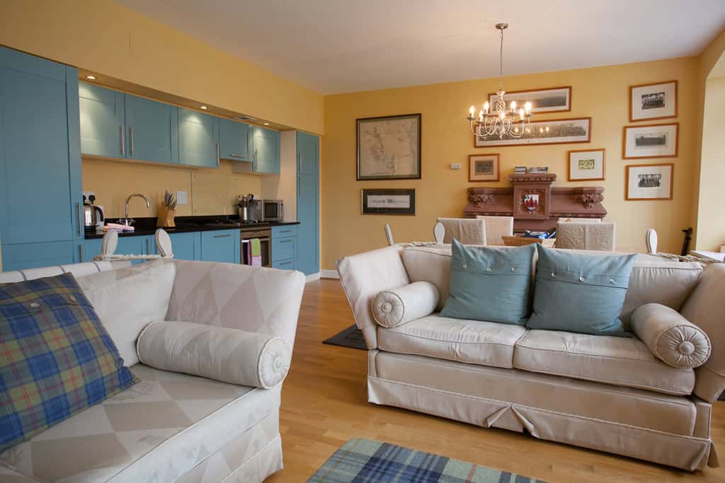 HCS Development modern living room with comfortable sofas and elegant decor.
