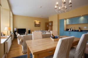 Spacious Highland Club living room with comfortable seating and contemporary decor.
