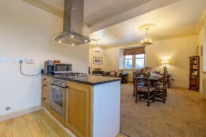 Spacious living room and kitchen area at Highland Club development in Scotland.