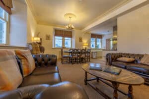 Spacious Highland Club lounge with classic furniture and large windows.
