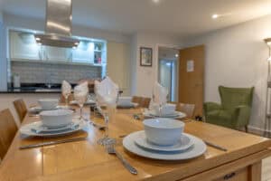 Highland Club Scotland luxury accommodation with stylish dining and kitchen area.