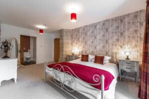 Elegant Highland Club bedroom with stylish decor and comfortable furnishings.