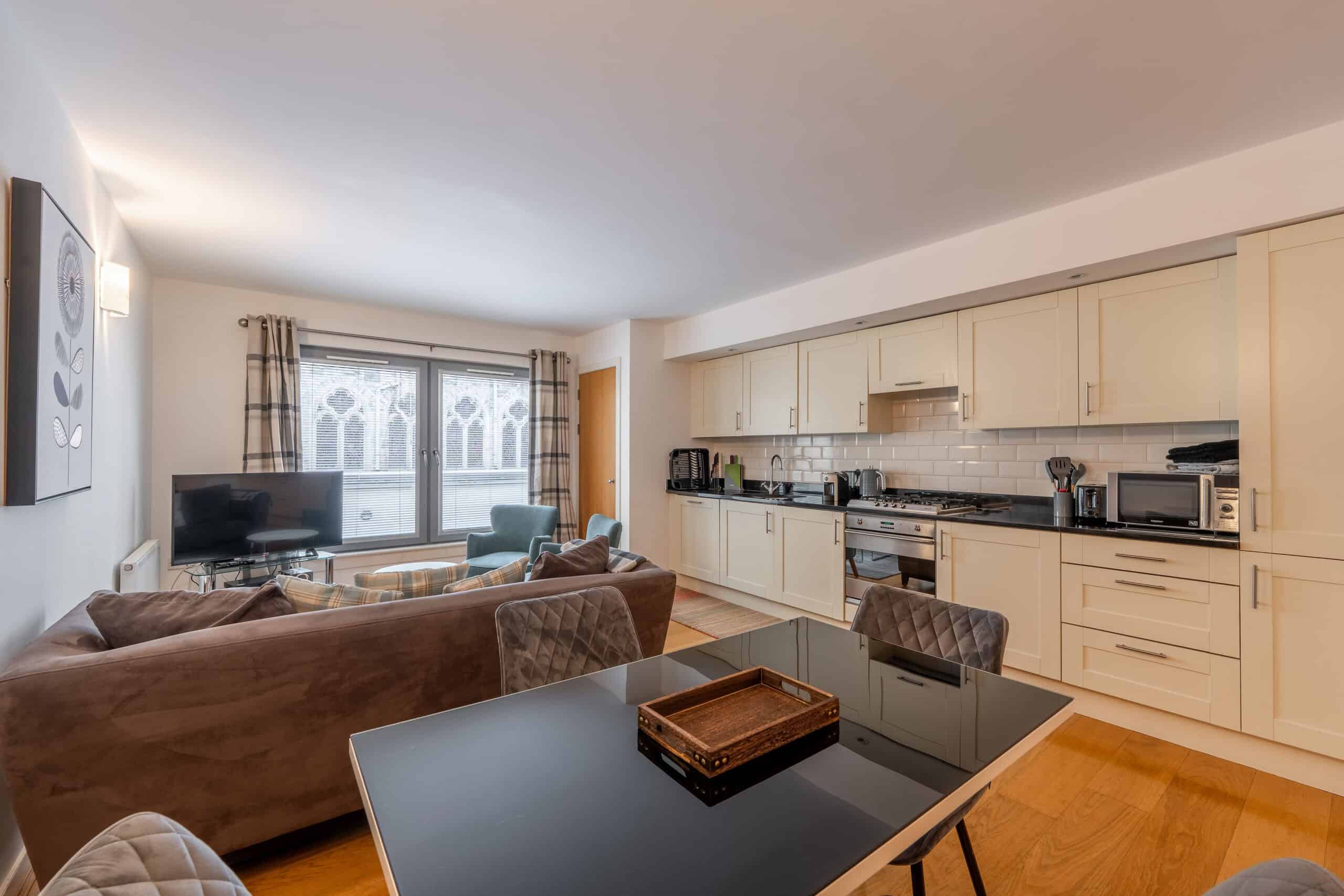 Bright and spacious Highland Club Scotland apartment with open-plan living and kitchen area.