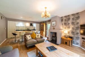 Spacious Highland living room with modern decor and cozy fireplace.