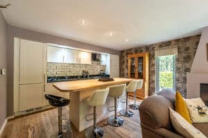 Bright and spacious kitchen with a breakfast bar in Highland Club Scotland property.