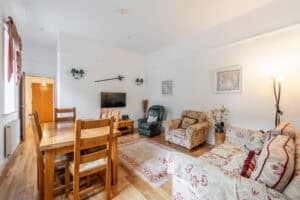 Living room at Highland Club Scotland with traditional furnishings and modern amenities.