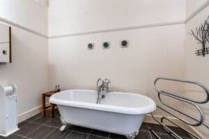 Freestanding bathtub in Highland Club Scotland spa with vintage clawfoot design and modern fixtures.