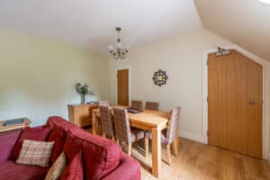 Comfortable living and dining area in Highland Club apartment, Scotland.