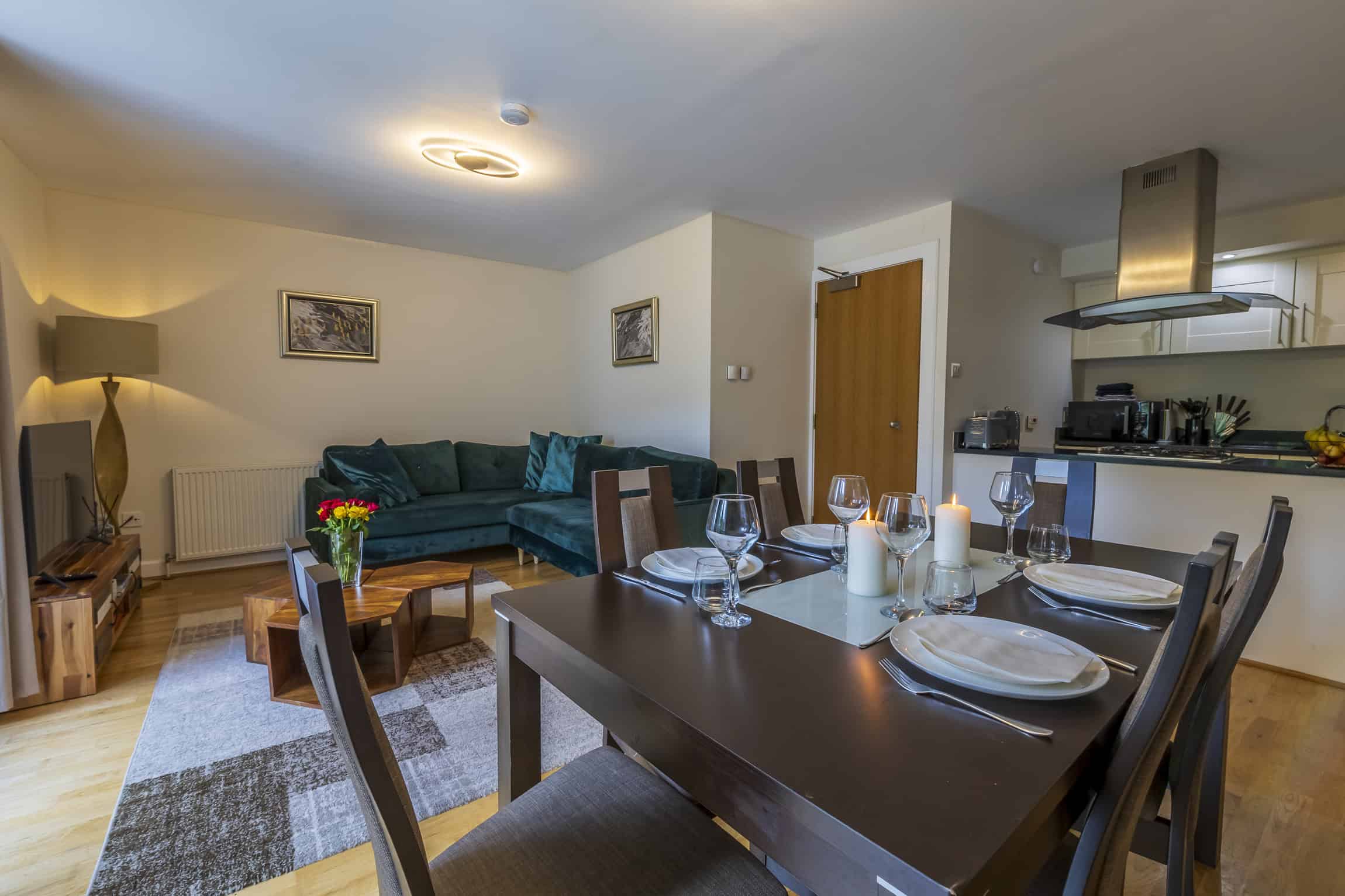 Modern open-plan living and dining area in Highland Club Scotland apartment.