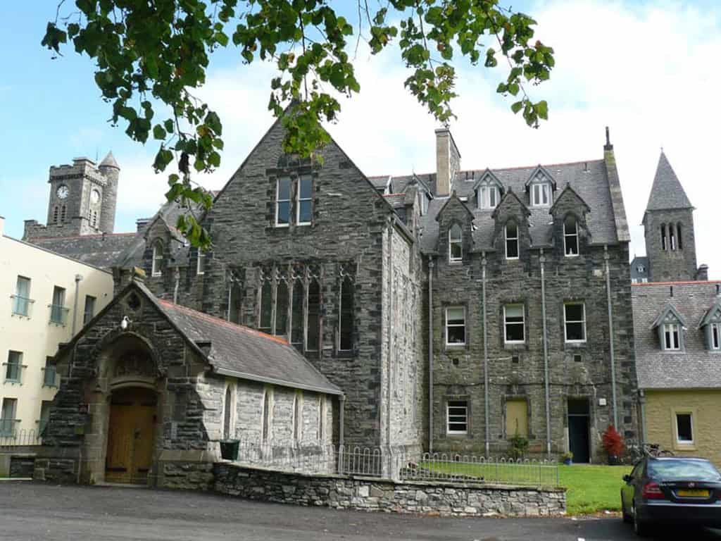 Historic stone building with Gothic architecture at Highland Club Scotland.