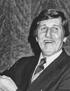 LloydAllen Historical man in a suit at The History Museum, showcasing the museum's exhibits and community heritage.