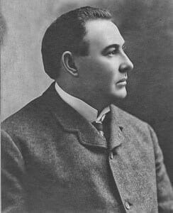 edFogarty Young man in early 20th-century formal attire, vintage portrait for history museum exhibit.