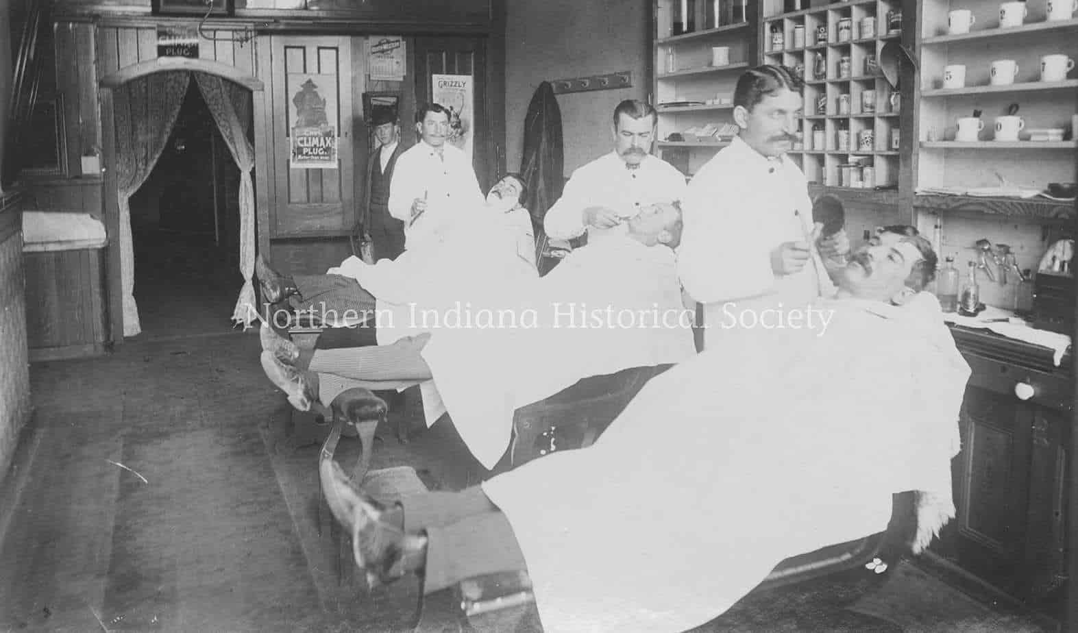 Oliver Hotel barber shop ph538 Vintage black and white photo of early 20th-century medical professionals performing a procedure in a historical clinic.