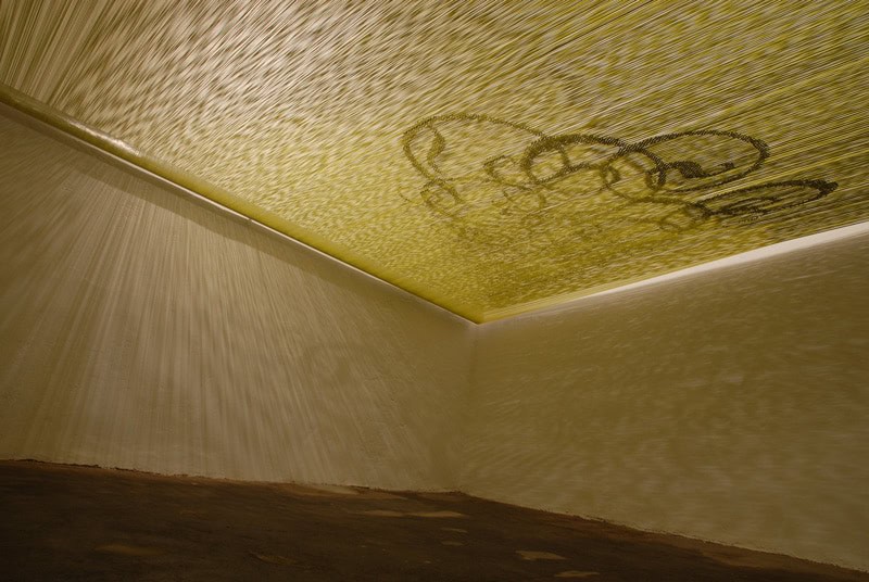 Close-up of textured ceiling with graffiti art in a modern interior.