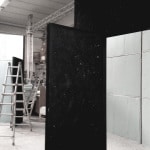 Contemporary Art Installation With Large White Panels And Black Partition In Studio.