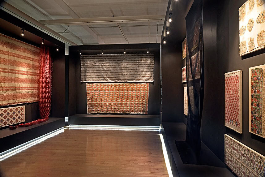 Exhibition of traditional woven rugs and textiles at arcHITects srl.