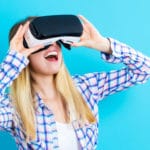 Woman Using Virtual Reality Headset For Architectural Visualization.