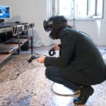 Person Using A Vr Headset In An Indoor Setting At Salone Del Mobile 2017.