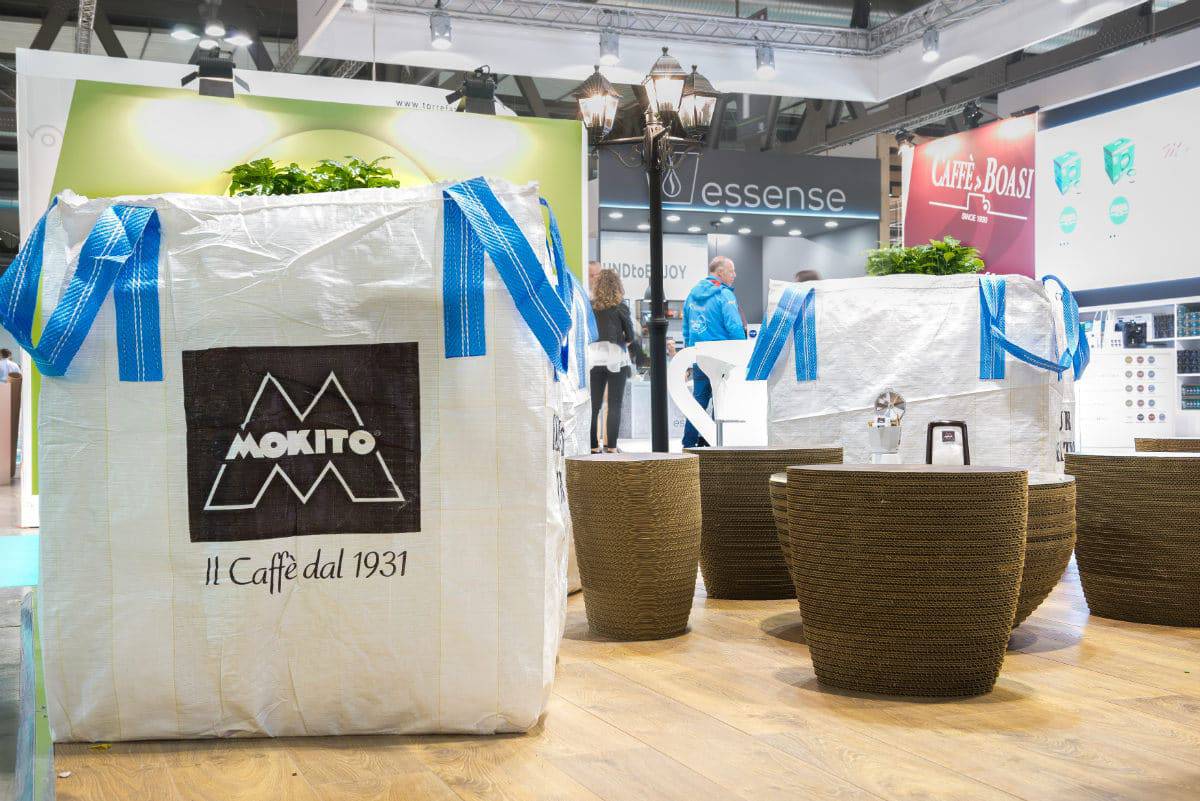 Large decorative planters with blue ribbons at Stand Mokito - Host 2017.