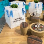 Decorative Tables With White Covers And Blue Ribbons At Stand Mokito 2017 Event.
