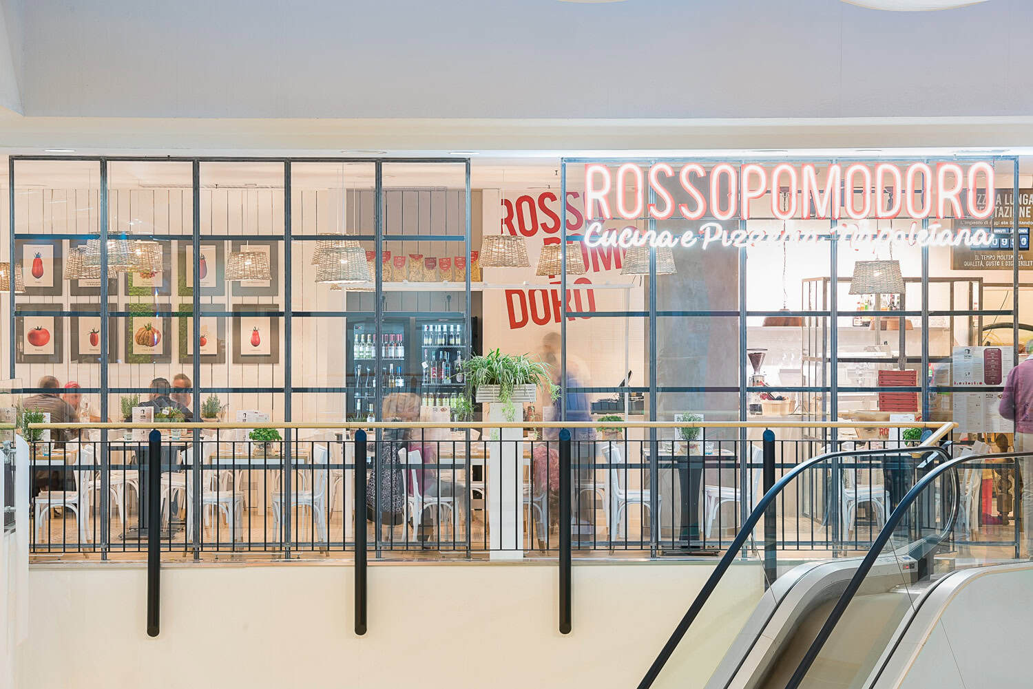 Rossopomodoro restaurant storefront with modern decor and signage.