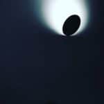 Dark Circular Object Illuminated By A Bright Light Source Behind It.